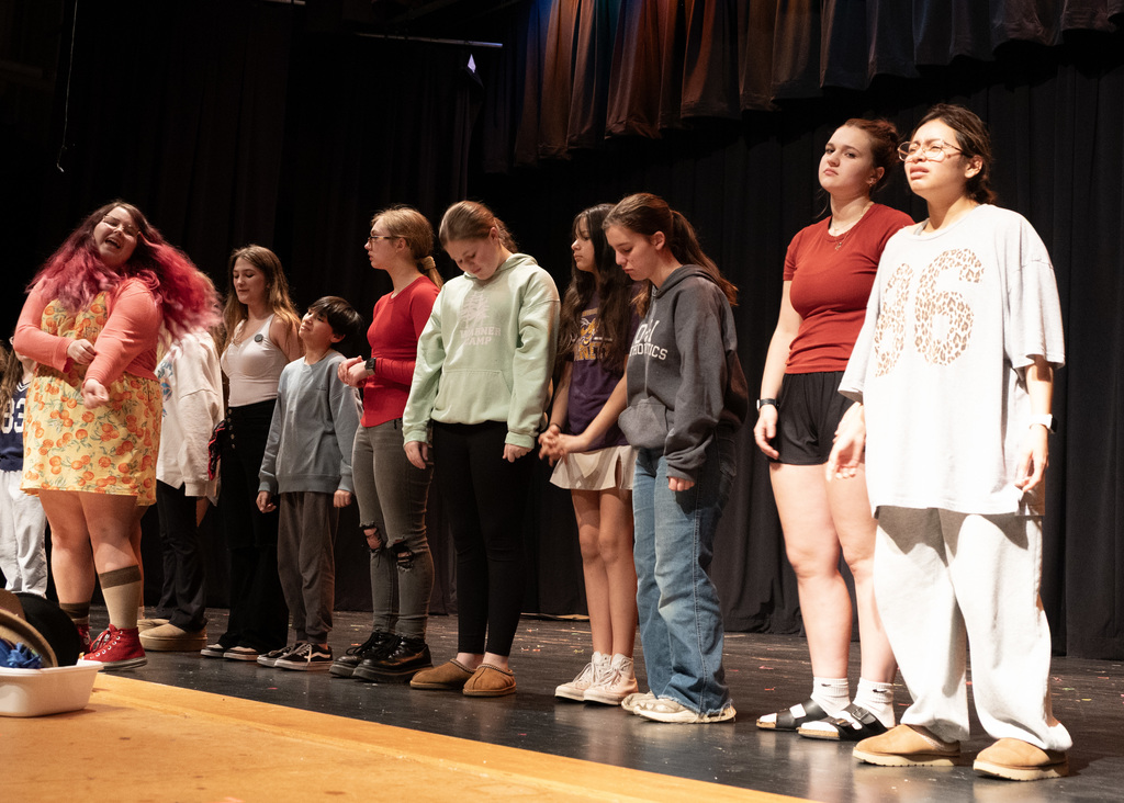 line of people with one in front looking back at the rest