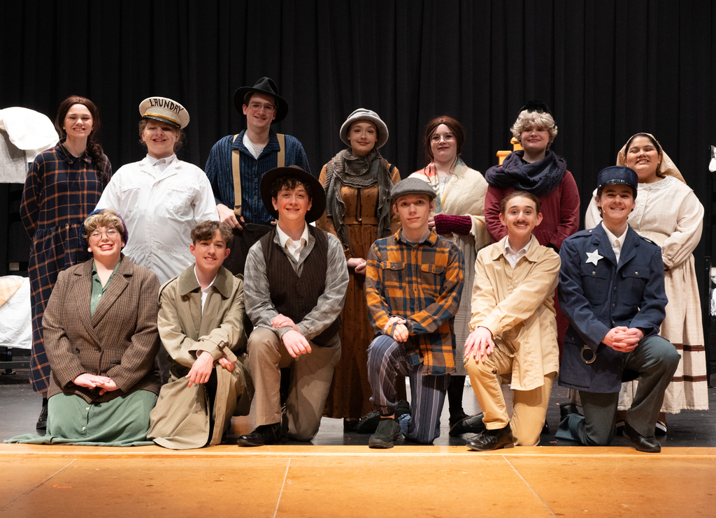 group of people dressed in costume of the 30's