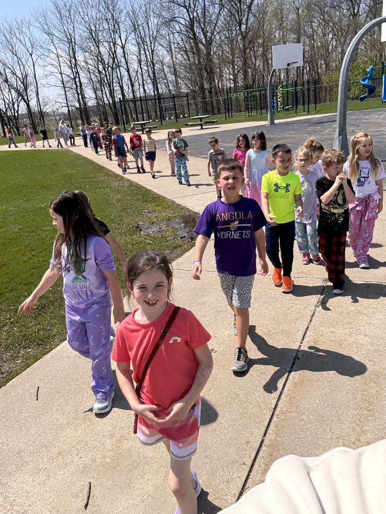 Children walking in a line outside