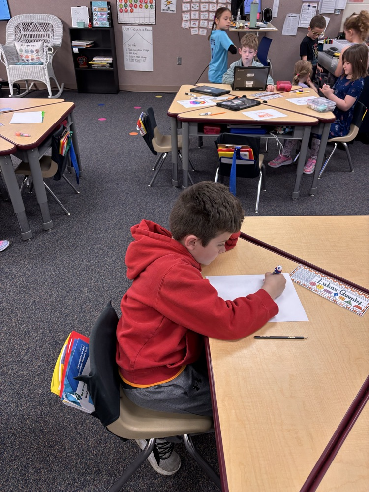 Child writing at a desk