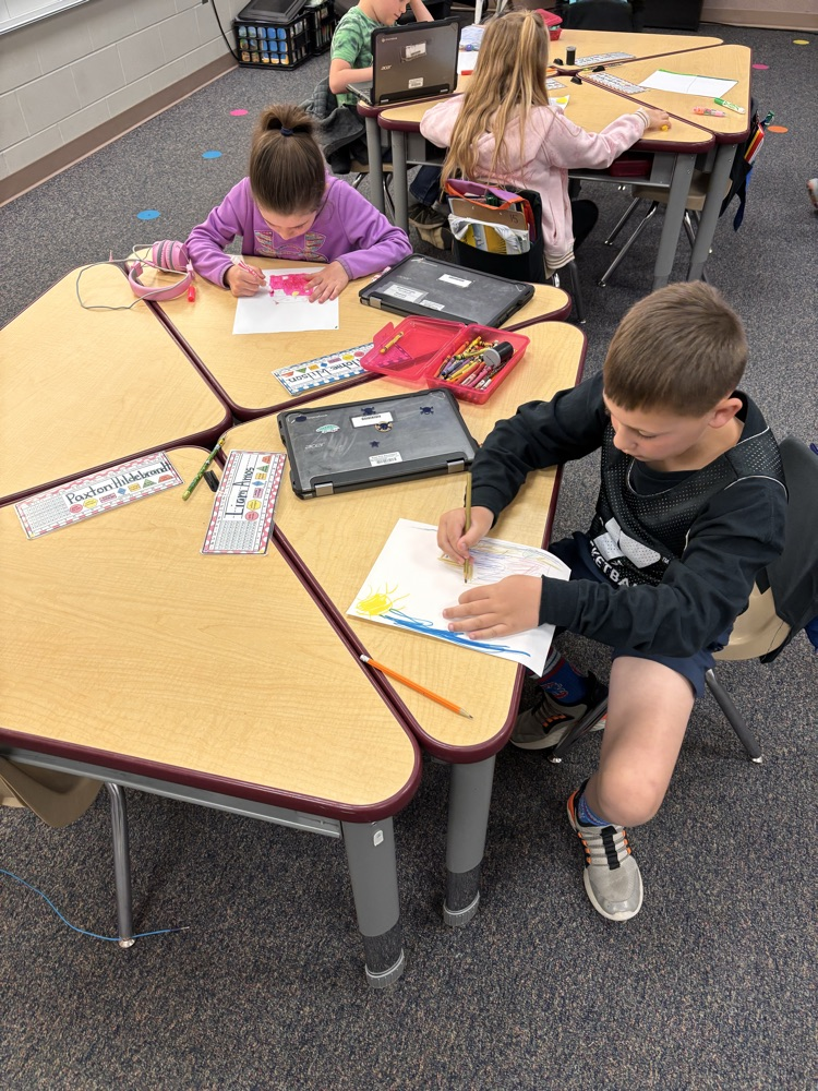 Child writing at a desk