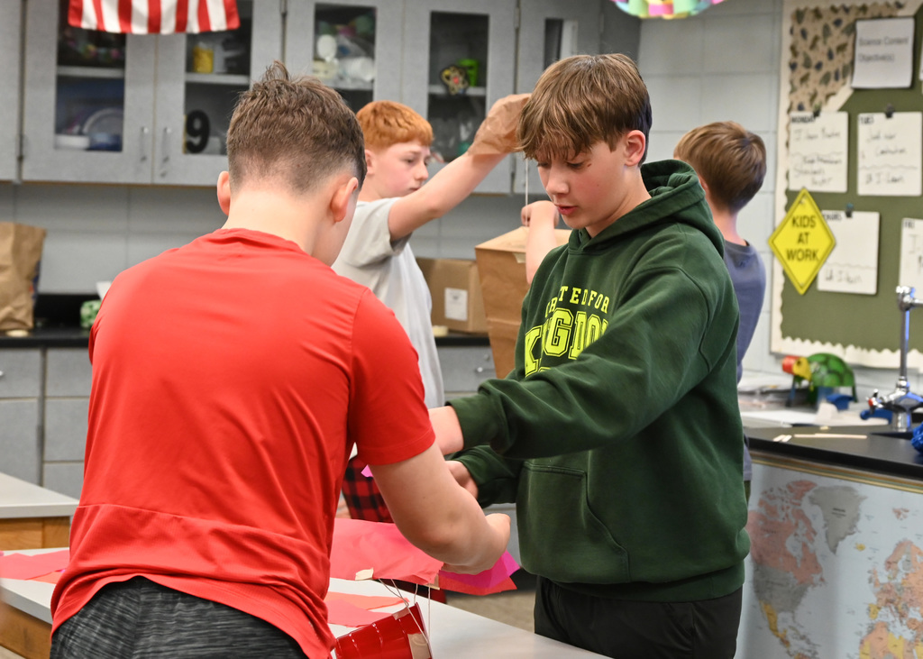 Two middle schooler working on a project