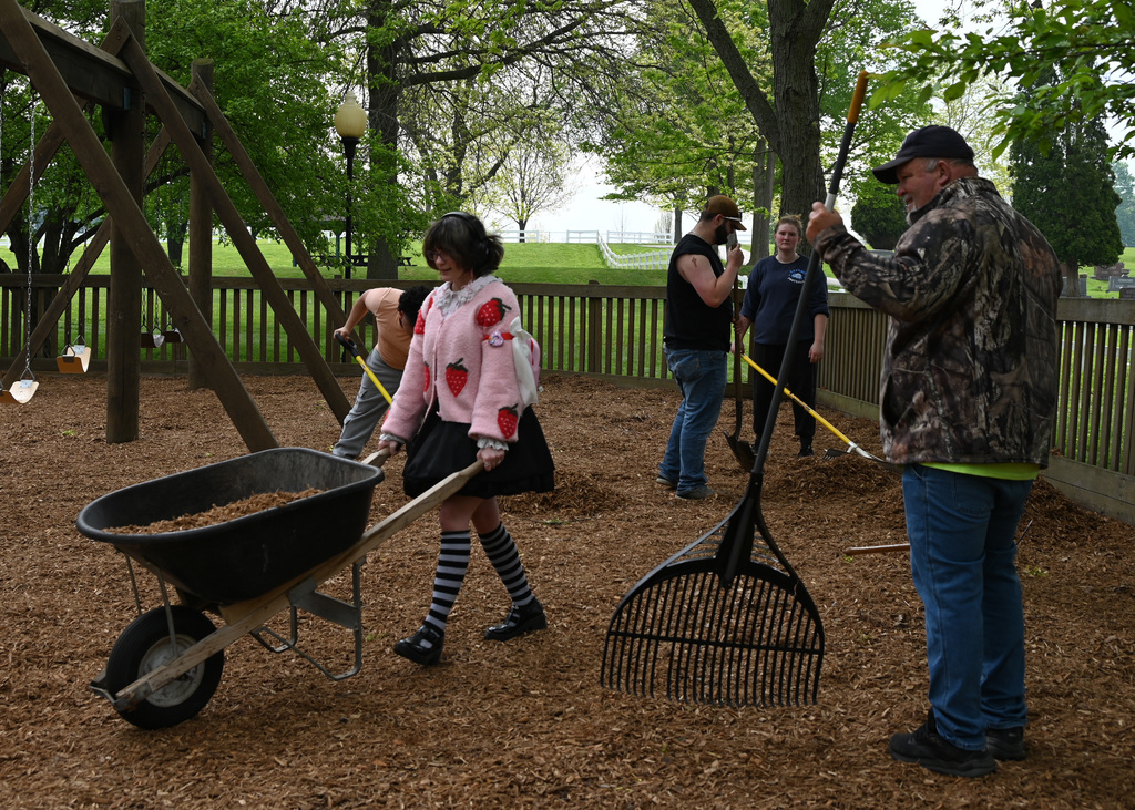5 people doing yard work