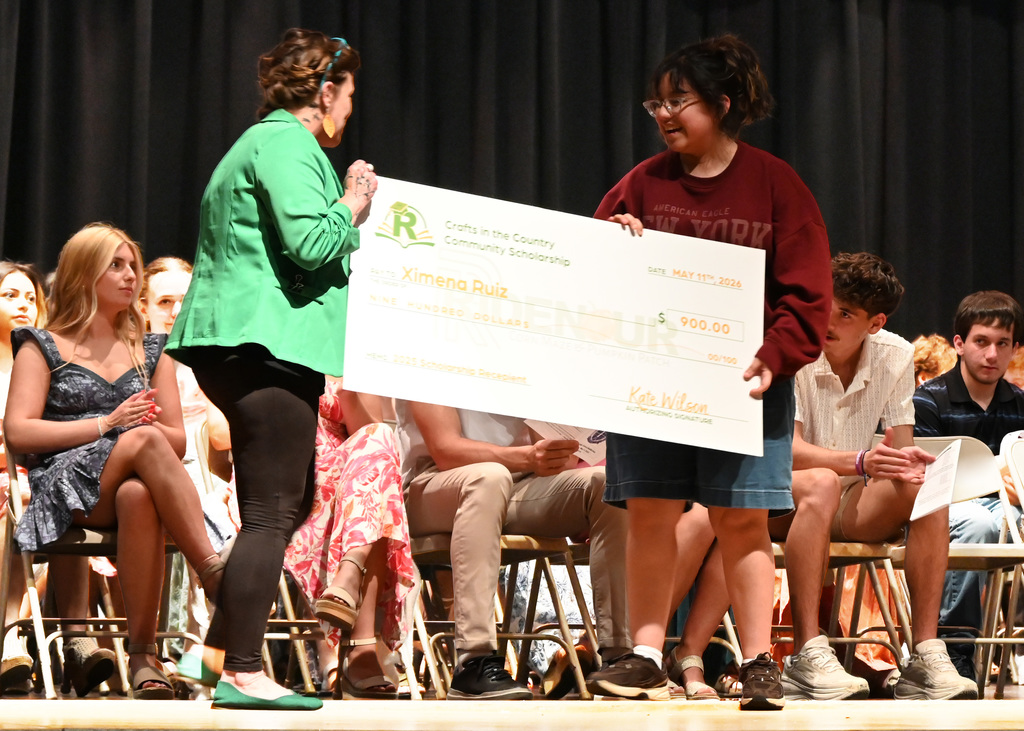 girls and woman holding a giant check