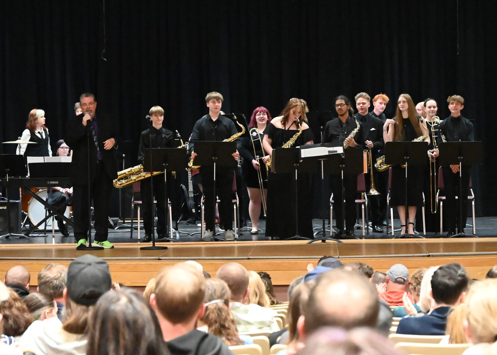 High school jazz band on stage taking a bow
