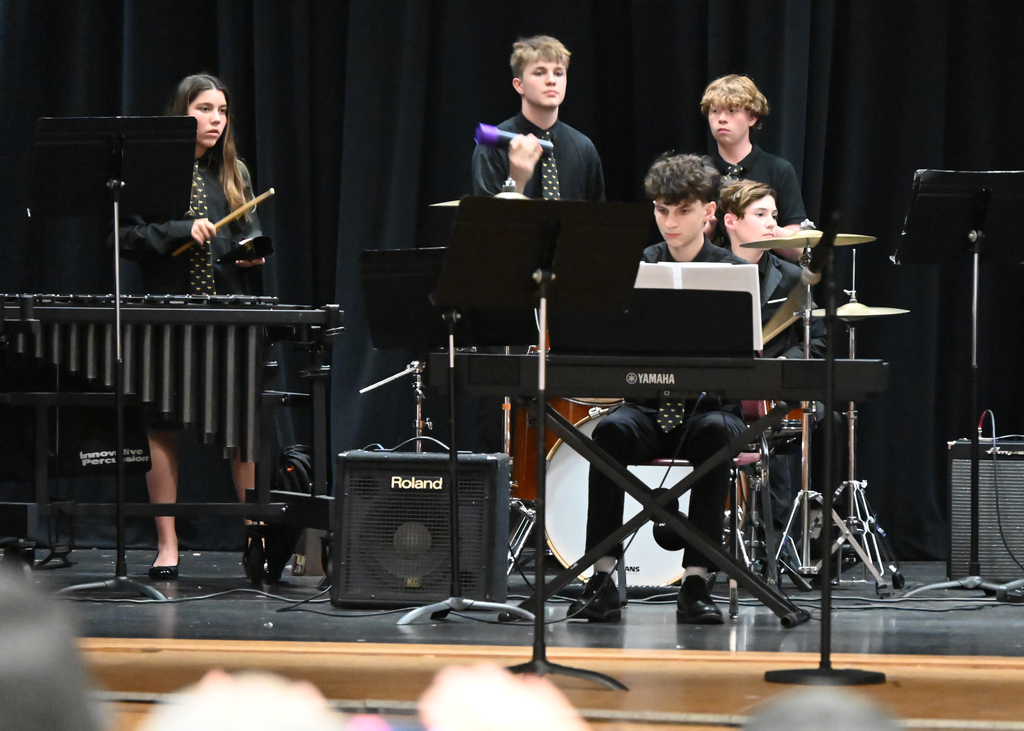 middle school students plain piano, maracas, drums and marimba
