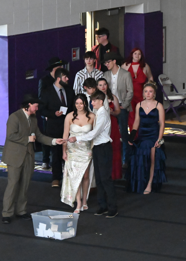 couples in prom attire in a line