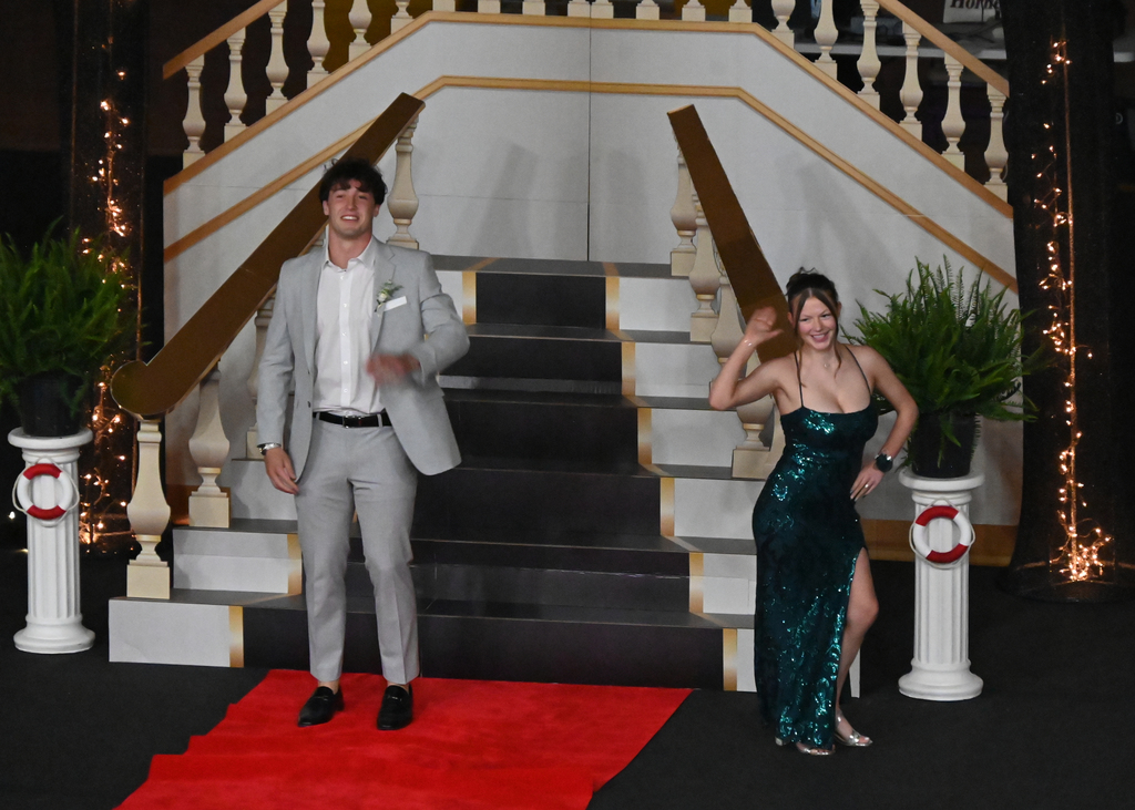 girl in dress boy in tux dancing