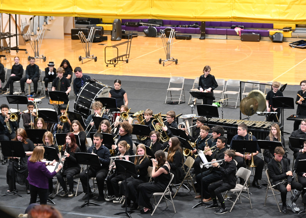 7th grade band students playing being lead by a directory