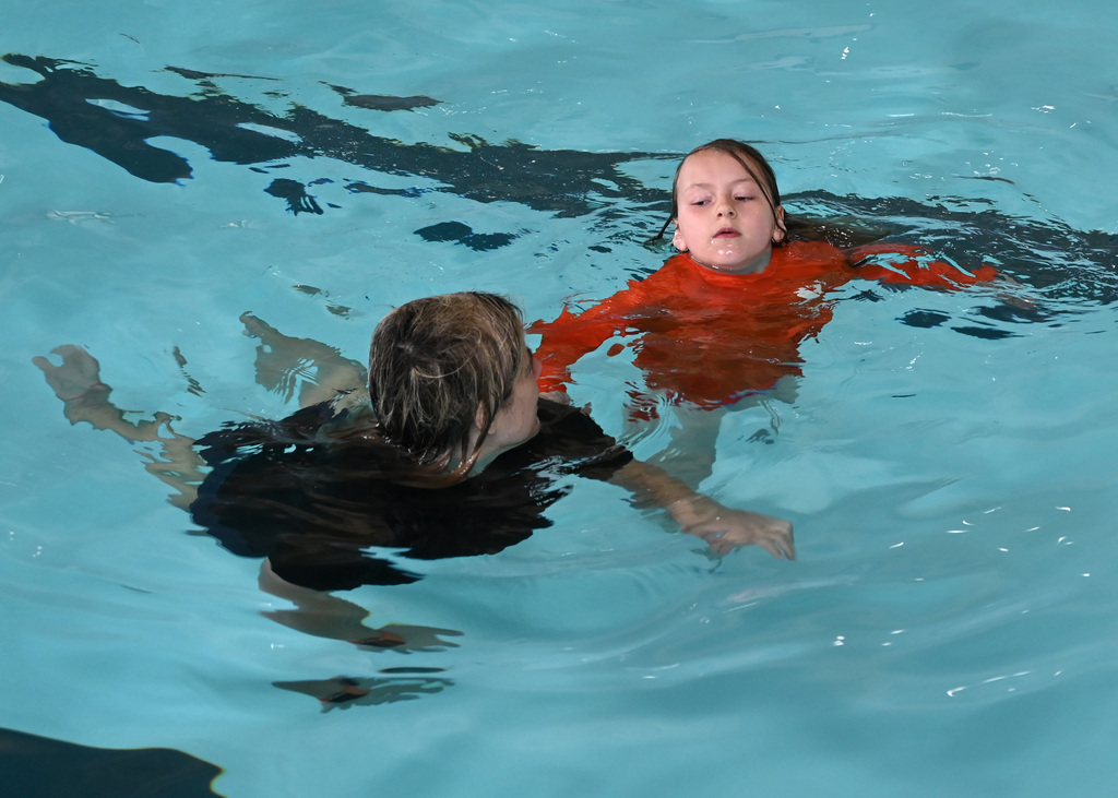 womand and child swimming