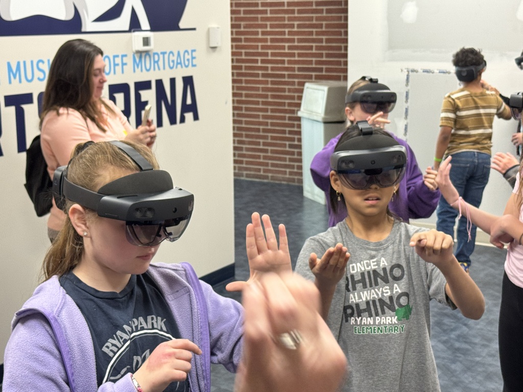 3 kids playin using vr headsets