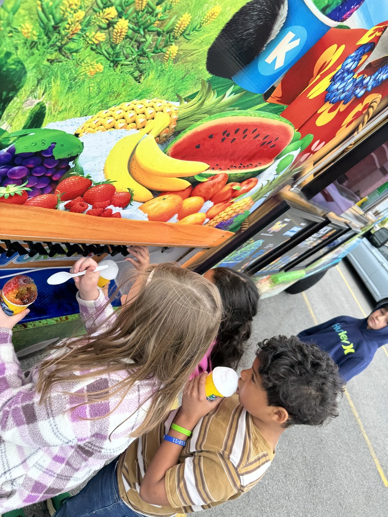 students making snowcones from snow cone truck