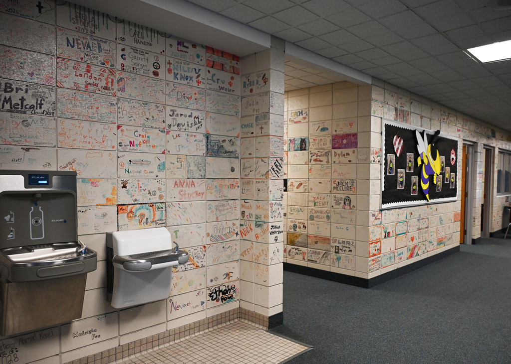 walls of a school with draings on the blocks of the walls