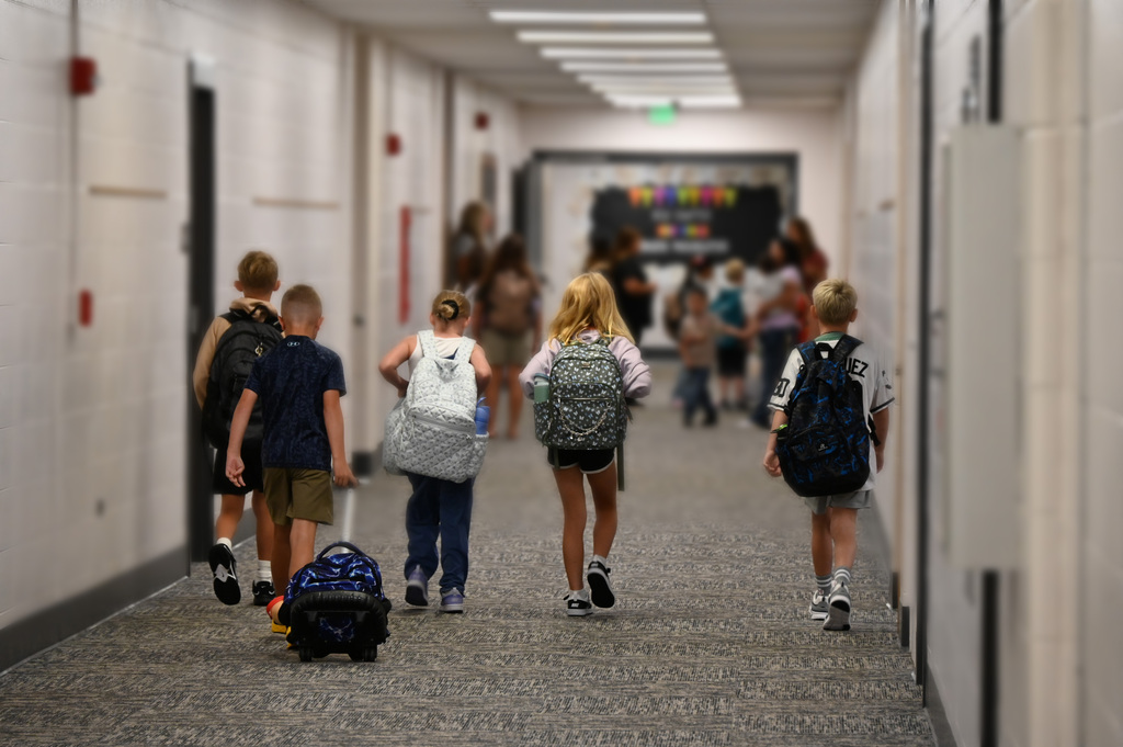 chidren walking down hall