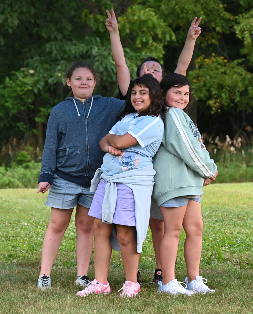 4 kids posing for a photos