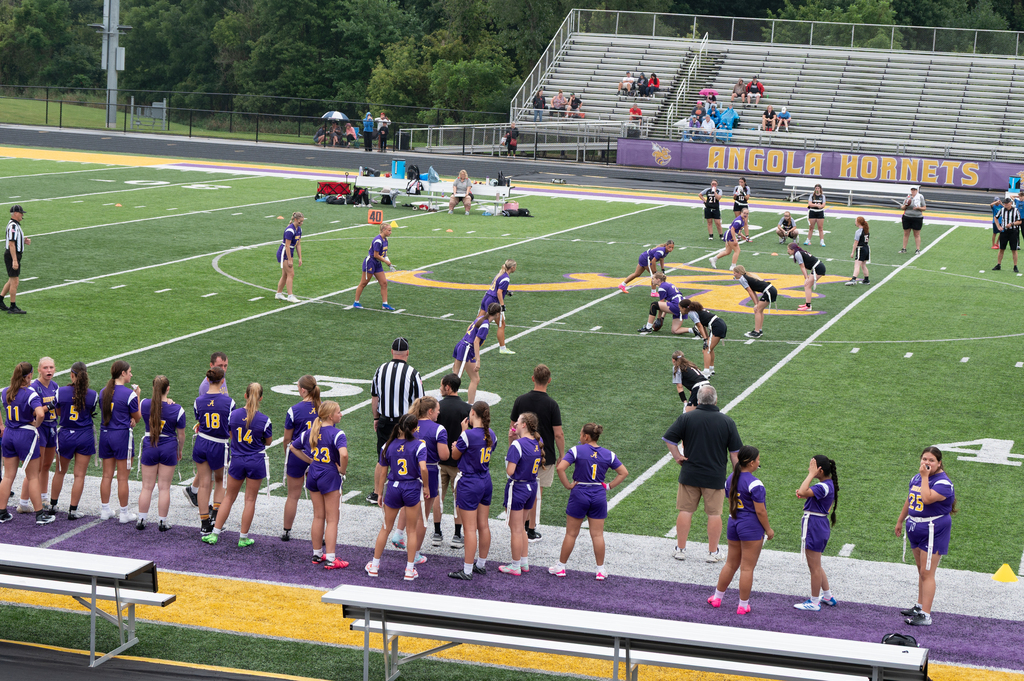 team on sidelines and on football field for flagfootball game