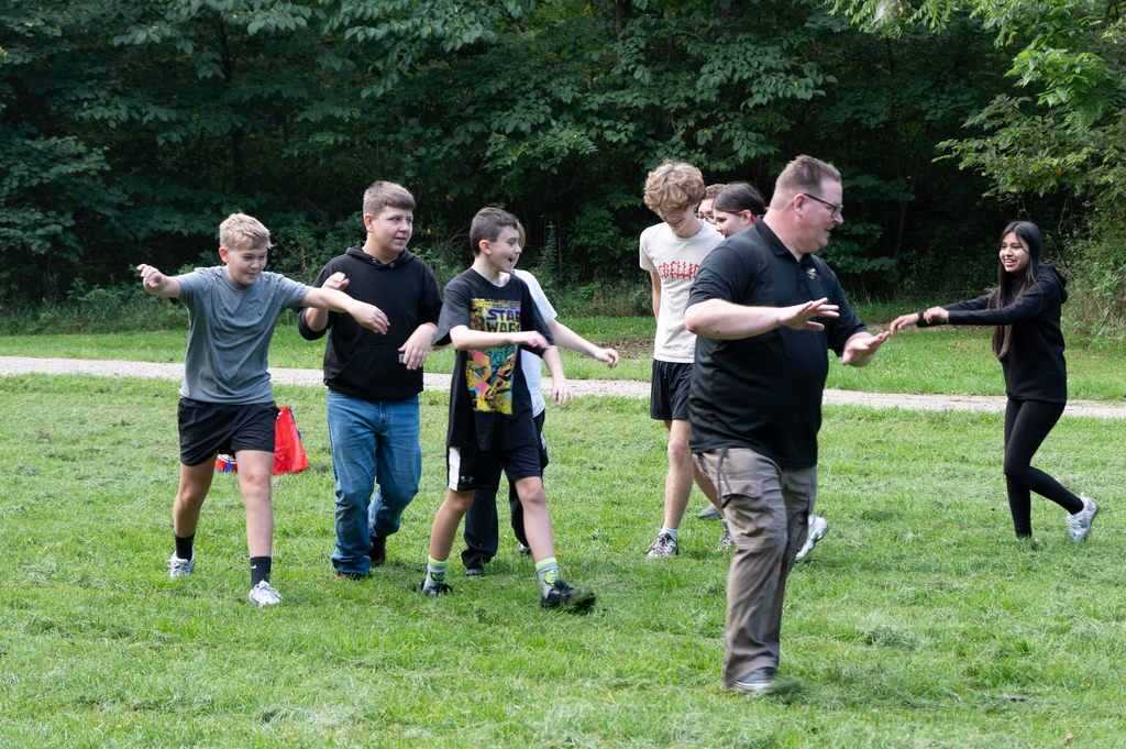 group of people running in a field