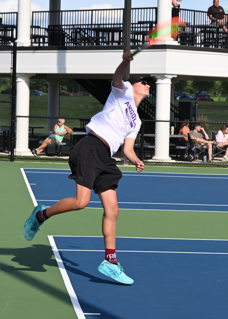 tennis player swinging racket