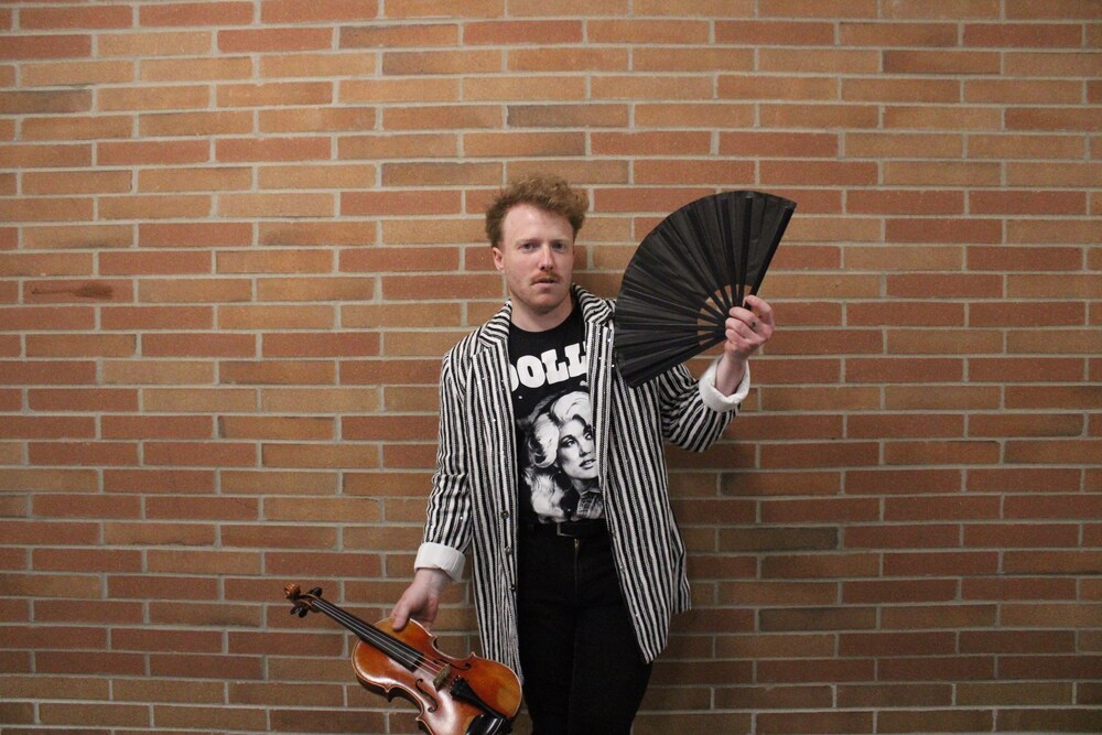 Zachary Himes poses with an instrument