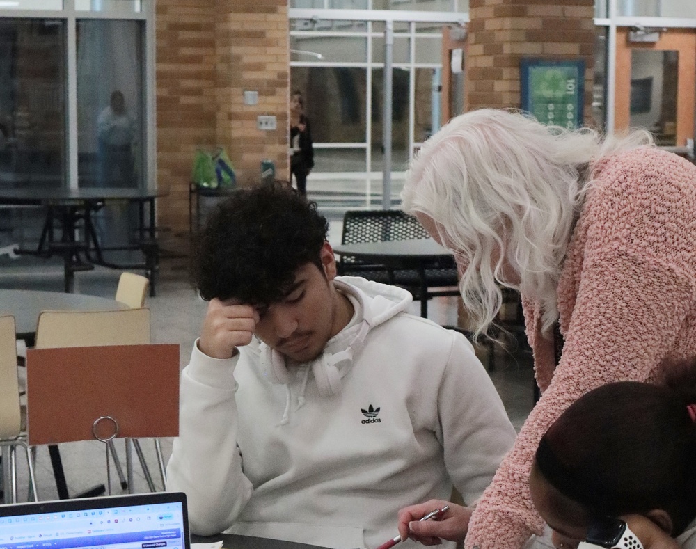 Teacher Sherri Nelson helps a student