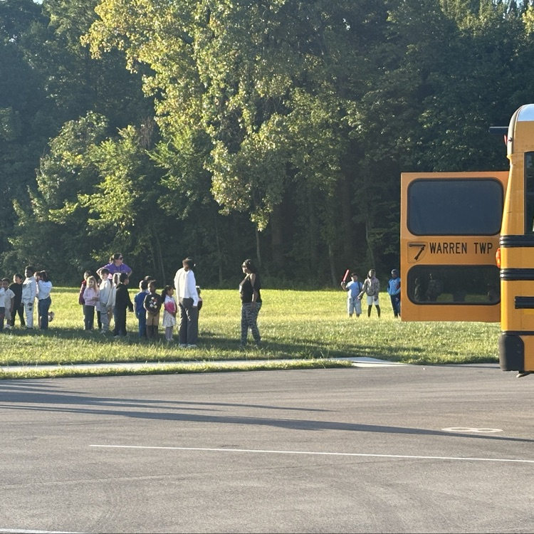 Students lining up in the grass