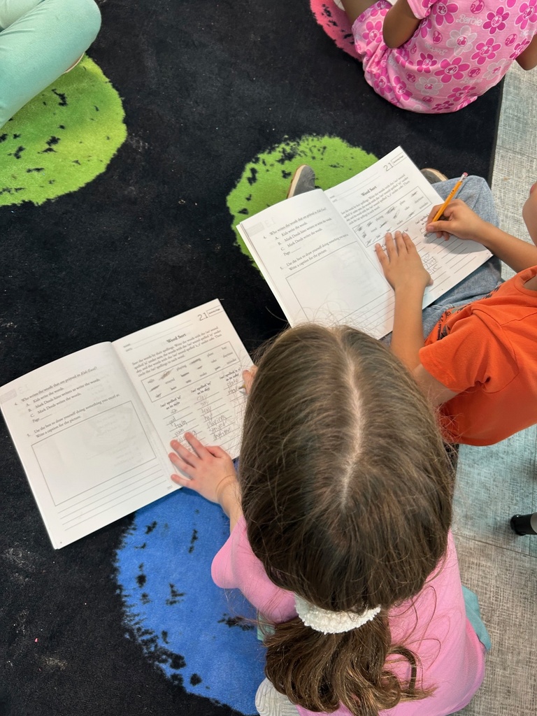 Students sorting words based on their sound spelling.