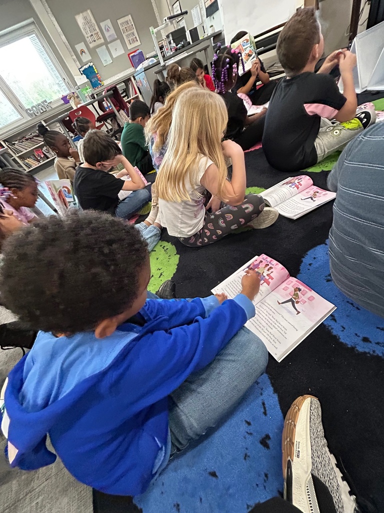 Students in 2nd grade are reading a story to check for understanding.
