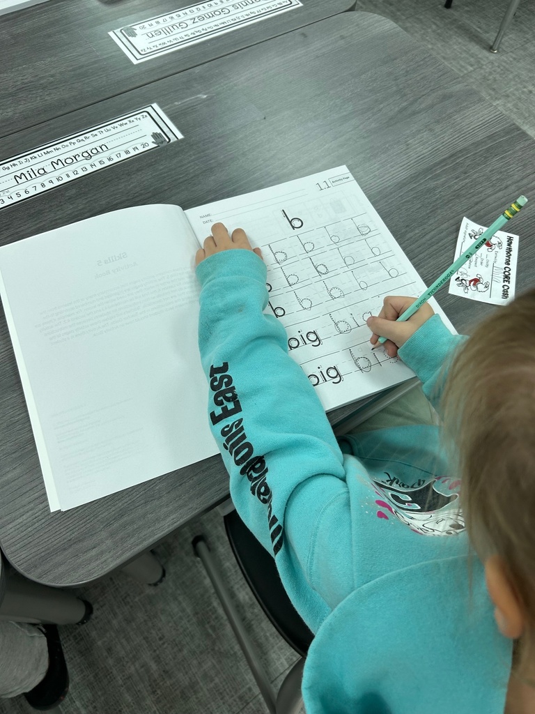 Kindergarten student practicing encoding the new sound /b/.