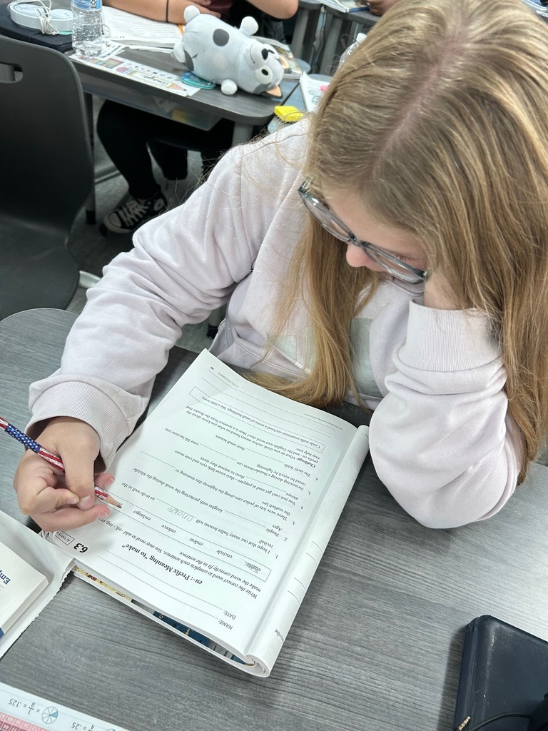 Fourth grade student working on morphology of a new prefix.