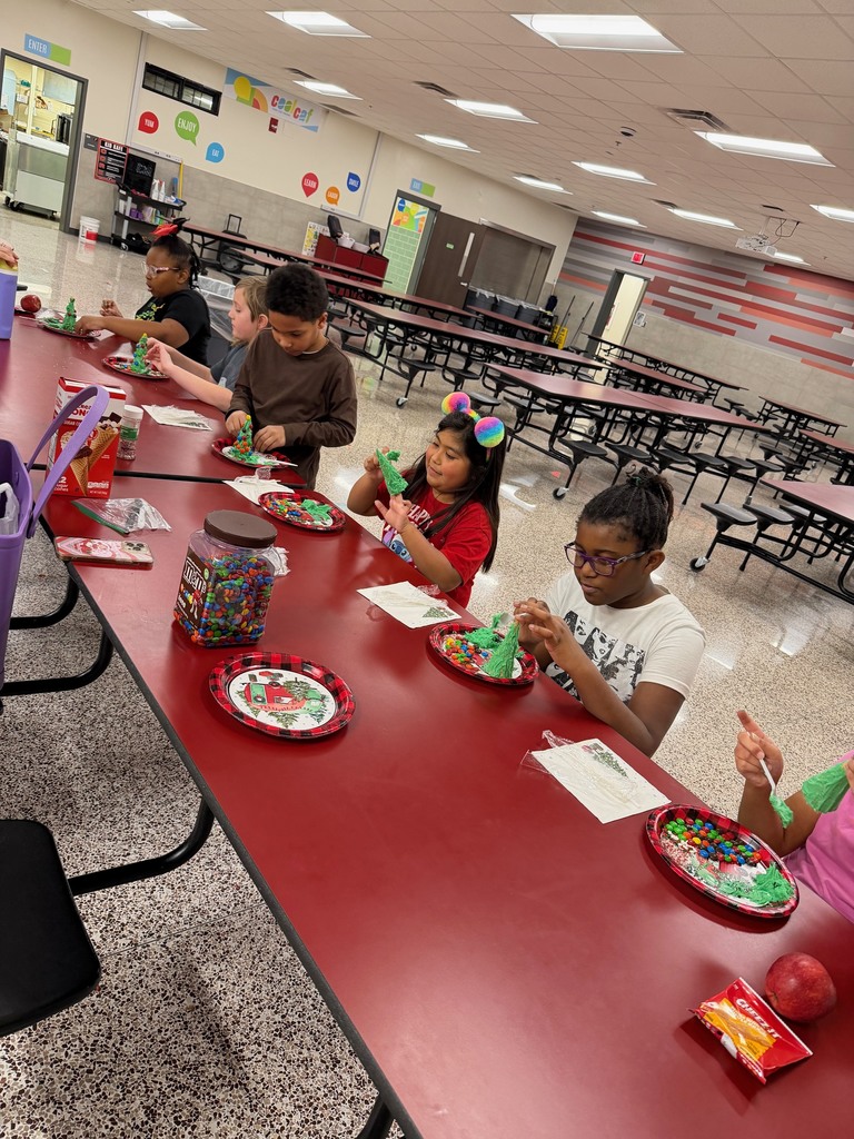 Students are creating tasty christmas trees for a fun celebration!