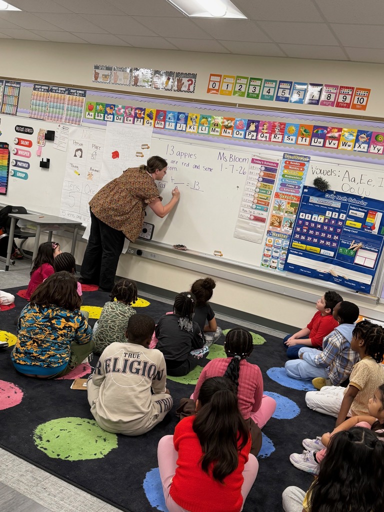 First grade students working on creating addition word problems.