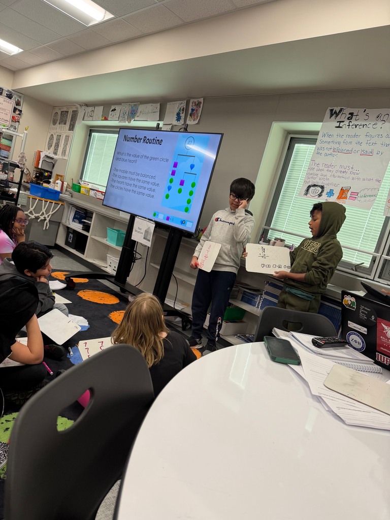4th grade students explaining how they solved the math problem.