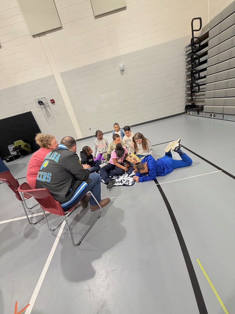 Third grade students enjoying a read aloud.