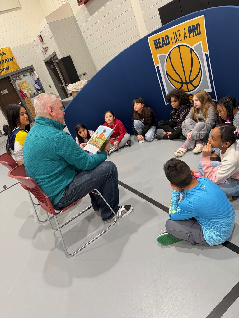 Third grade students enjoying a read aloud.