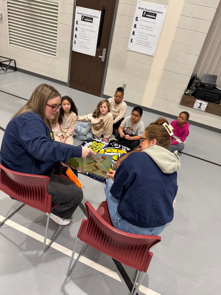 Third grade students enjoying a read aloud.