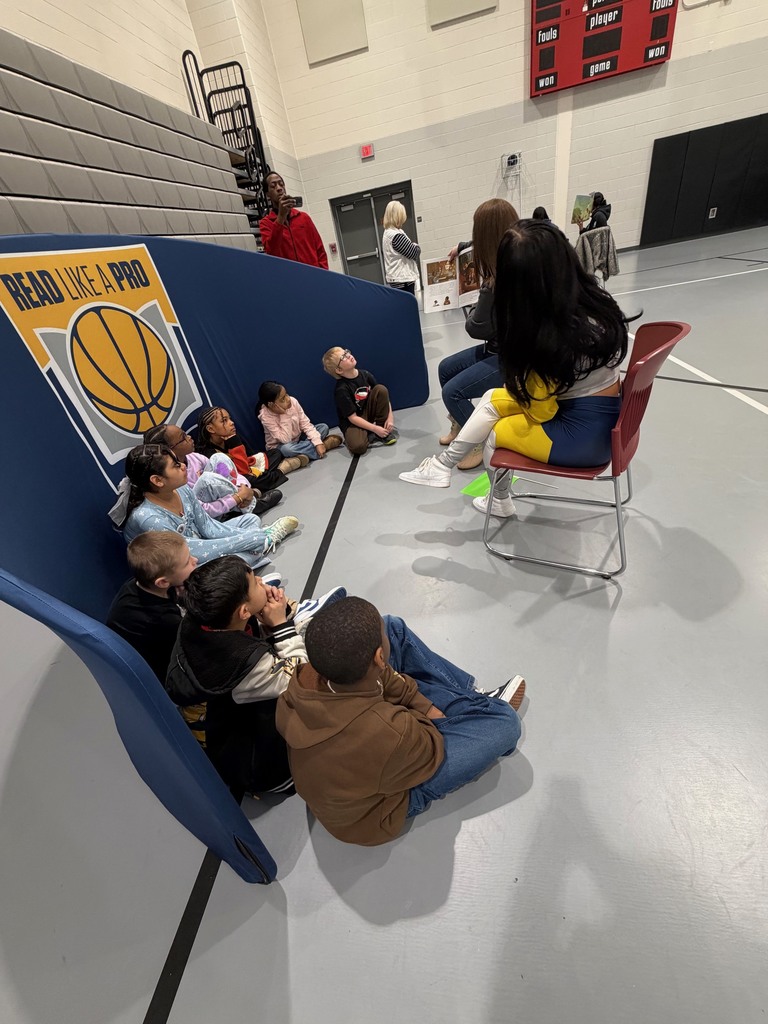 Third grade students enjoying a read aloud.