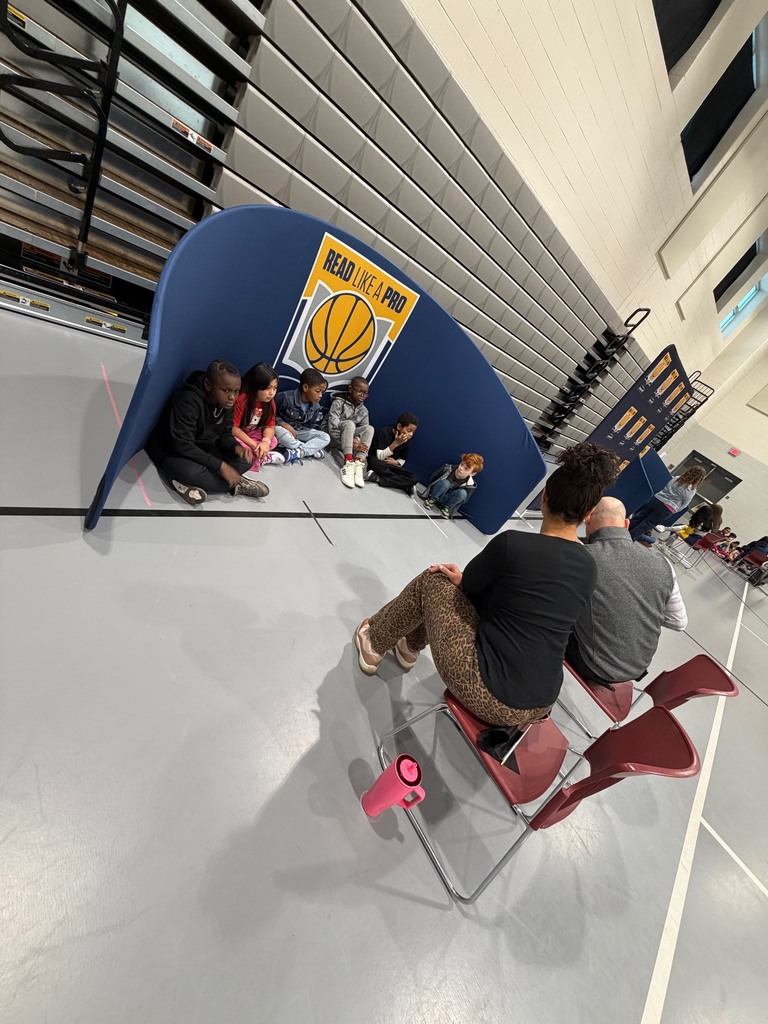 Third grade students enjoying a read aloud.