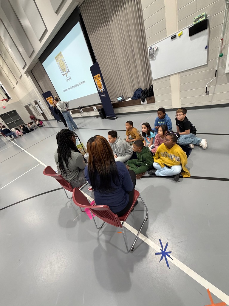 Third grade students enjoying a read aloud.