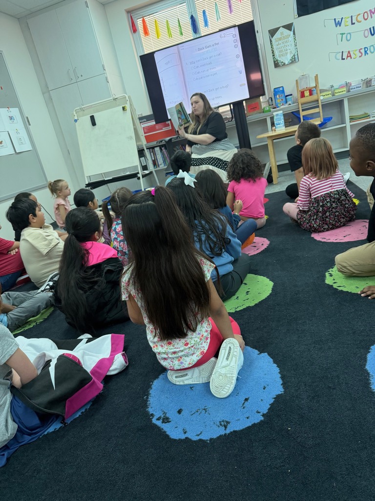 Kindergarten students listening to a story.