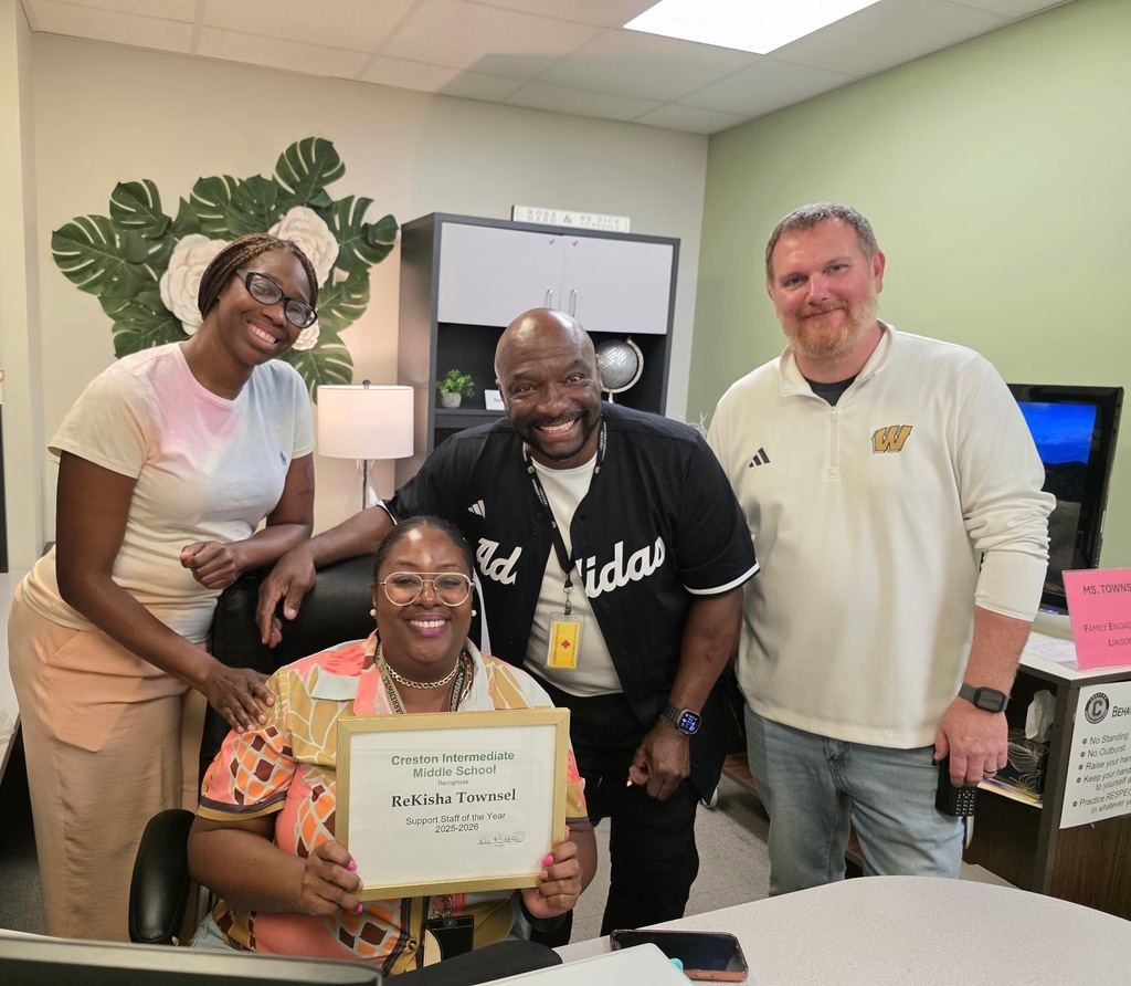 The Admin Staff present the award. (Left to Right) Ms Stewart, Ms Townsel, Dr. Nailon, Mr Bonarr