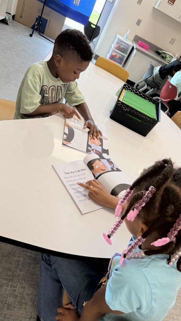 Students are reading in a small group with a partner.