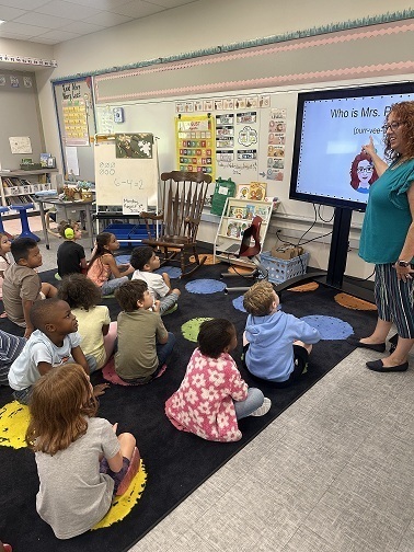 Mrs. Purvitis, the new school counselor, introduces herself to  Ms. Pelt's class.  