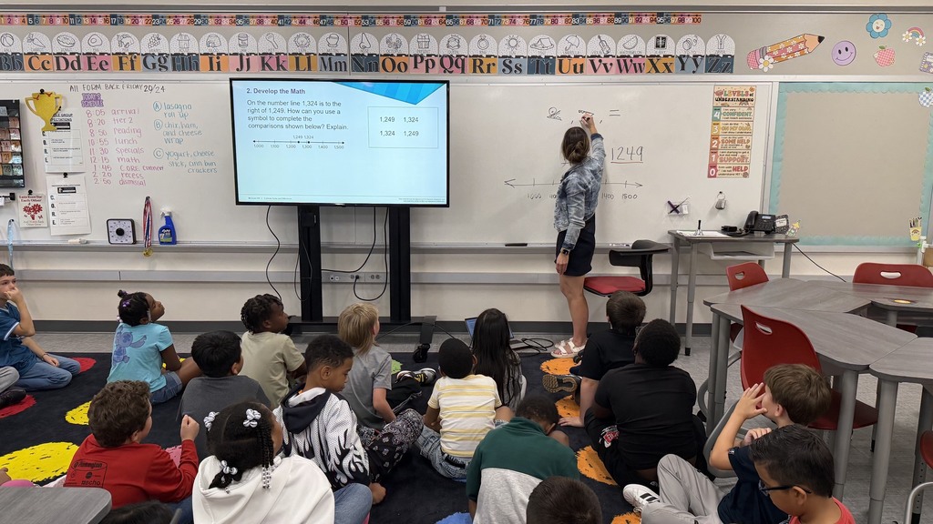 Third grade students comparing numbers using a number line.