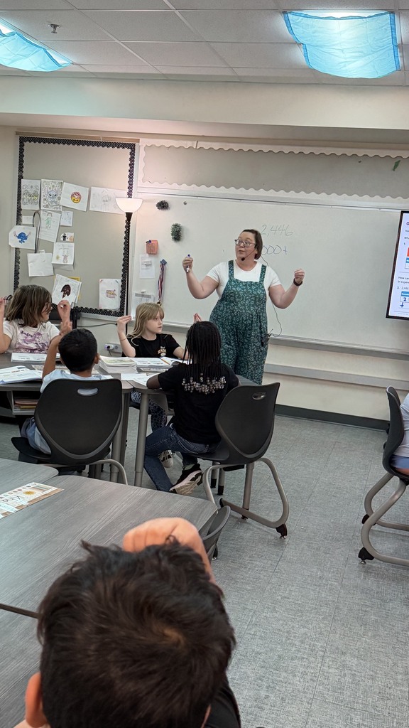 Third grade students working on decomposing numbers to write them in expanded form.