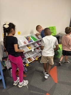 Students looking at items for sale.