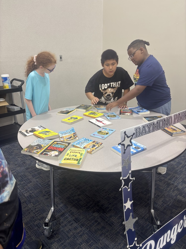 students picking books 
