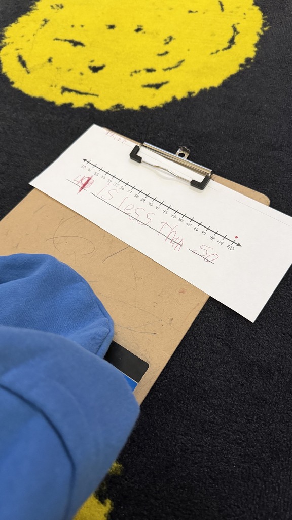 1st grade students comparing numbers on a number line.