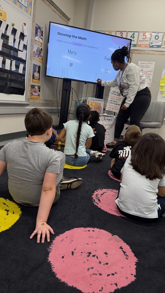 1st grade students comparing numbers using quick tens.