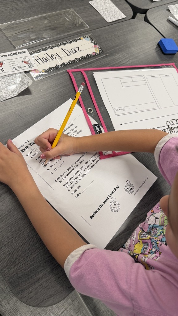 2nd grade students using word problem strategies on their exit ticket.