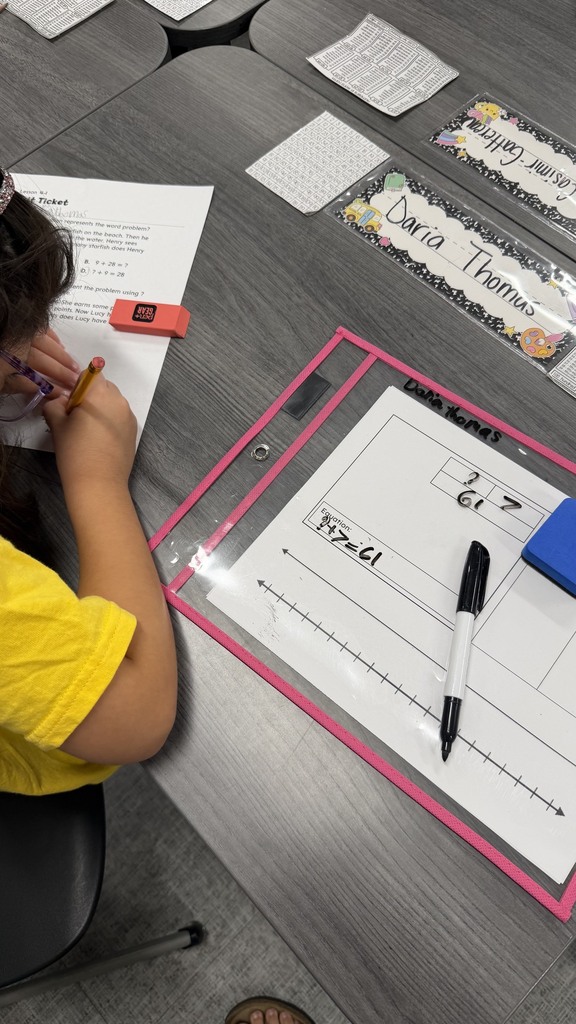 2nd grade students using word problem strategies on their exit ticket.